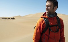 Ryan Pyle trekking through the Badain Jaran desert, in northern China, while filming for Discovery Channel. Photo: Ryan Pyle