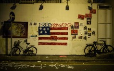 Graffiti on a wall after violent demonstrations took place in the streets of Hong Kong on the 70th anniversary of the founding of the People’s Republic of China. Photo: AFP
