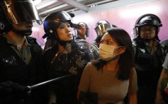 A member of the public reacts as police arrest people on suspicion of being anti-government protesters, in the Kowloon Bay area of Hong Kong on September 3. Photo: EPA-EFE