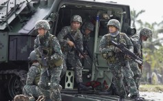 Troops from the Philippine Marines and Armed Forces reservists conduct an amphibious landing exercise. Photo: EPA