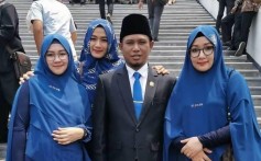 Achmad Fadil Muzakki Syah, 39, and his three wives. Photo: Twitter