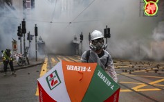 Clouds of tear gas have little effect on an anti-government protester in Wan Chai. Photo: Sam Tsang