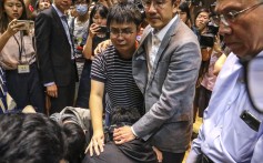 Chinese University pro-vice-chancellor Dennis Ng comforts students as they get emotional after a meeting with the school’s president. Photo: K.Y. Cheng
