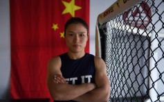 Chinese fighter Zhang Weili poses before her UFC strawweight world title fight against Brazilian champion Jessica Andradem, in Shenzhen on August 31. She would win the bout in just 42 seconds. Photo: AFP