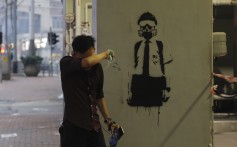 A man wipes his eyes after yet another weekend of tear gas on the streets of Hong Kong, on October 6. Photo: AP