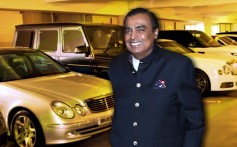 Mukesh Ambani with some of his cars in his garage – the first six floors of the Ambanis’ Antilla home is dedicated to cars. Photo: YouTube
