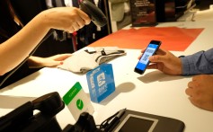 A customer using the Alipay payment service at the German department store Breuninger in Dusseldorf, Germany on June 29, 2018. Photo: Xinhua