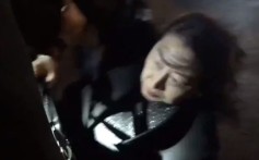 Teresa Cheng, Hong Kong’s justice minister, falls in London on Thursday while surrounded by anti-Hong Kong government protesters. Image: Twitter