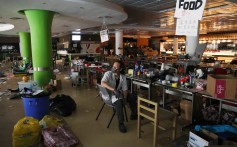 A protester who calls himself “Riot Chef”, and who says he was a volunteer cook for protesters, sits in a canteen in PolyU. Photo: Reuters/Leah Millis