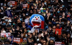 A person dressed as anime character Doraemon attends an anti-government rally in Hong Kong on New Year’s Day. Photo: Reuters
