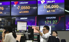 Currency dealers monitor exchange rates in a trading room at KEB Hana Bank in Seoul on August 6, 2019. The Chinese currency steadied that day, after it had weakened against the dollar, sending markets into freefall and leading the US to formally designate China a “currency manipulator”. Photo: AFP