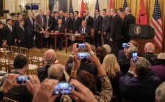 US President Donald Trump signed the deal with Chinese Vice-Premier Liu He in the East Room of the White House in Washington. Photo: EPA-EFE