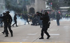 Police fire tear gas to disperse anti-government protesters in Central. Photo: Sam Tsang