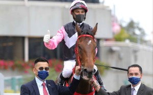 Joao Moreira celebrates after saluting aboard Beauty Live. Photo: HJKC