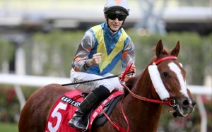 Harry Bentley pumps his fist after saluting aboard Grateful Heart. Photo: HKJC