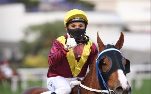 Alfred Chan is all smiles after saluting aboard Kurpany. Photo: HKJC