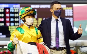 Matthew Chadwick and Douglas Whyte celebrate the victory of Smiling City at Happy Valley. Photo: HKJC