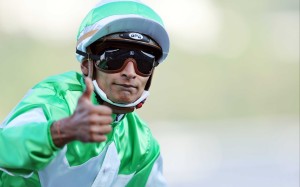 Jockey Karis Teetan celebrates a winner. Photo: HKJC