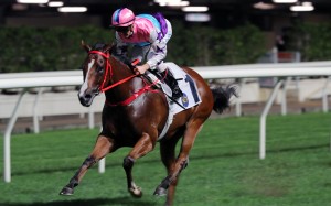 Gorgeous Vitality salutes under Zac Purton at Happy Valley on Wednesday night. Photo: Kenneth Chan