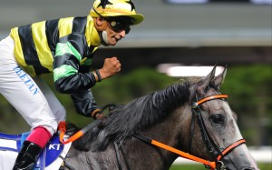 Karis Teetan punches the air after the win of Dragon Kingdom at Happy Valley. Photos: Kenneth Chan