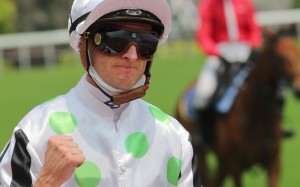 Zac Purton pumps his fist after winning the first race of the season. Photo: Kenneth Chan