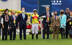 Jockey Alexis Badel (brown suit) with connections after Wellington’s Hong Kong Sprint win. Photo: Kenneth Chan