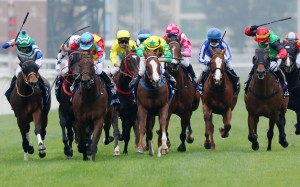 Wellington (pale blue cap) wins the messy Group One Hong Kong Sprint (1,200m) at Sha Tin on December 11. Photo: Kenneth Chan
