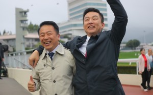 Trainer Ricky Yiu (left) celebrates Voyage Bubble’s BMW Hong Kong Derby win with his son Eric at Sha Tin on Sunday. Photo: Kenneth Chan
