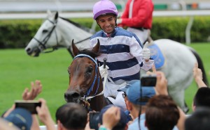 Joao Moreira returns a winner aboard Packing Hurricane at Sha Tin on Sunday. Photos: Kenneth Chan