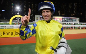 Hugh Bowman celebrates his 100th Hong Kong win after saluting aboard June Planet at Happy Valley last night. Photo: Kenneth Chan