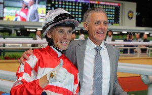 A beaming Mark Newnham celebrates his first Hong Kong win with jockey Lyle Hewitson. Photo: Kenneth Chan