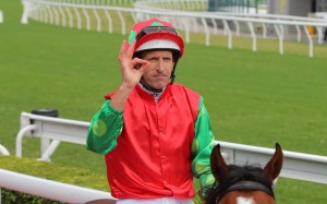 Hugh Bowman enjoys his victory aboard Invincible Sage last month. Photo: Kenneth Chan
