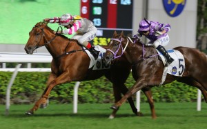 I Give (left) fends off a late challenge to make it five wins on the bounce at Sha Tin on Sunday. Photos: Kenneth Chan