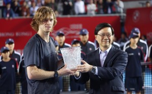 Chief Executive John Lee Ka-chiu (right) presents Andrey Rublev with his trophy on Sunday. Photo: Yik Yeung-man