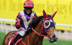 Jockey Alexis Badel is all smiles after winning the Group Three January Cup (1,800m) for the second time at Happy Valley on Wednesday night. Photos: Kenneth Chan