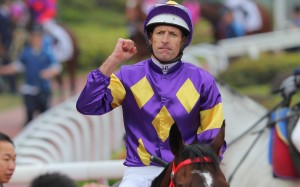 Hugh Bowman celebrates after winning the Classic Cup aboard Helios Express. Photo: Kenneth Chan