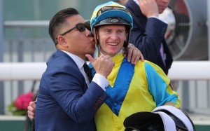 Trainer Dennis Yip kisses jockey Zac Purton after Massive Sovereign’s Hong Kong Derby success. Photos: Kenneth Chan
