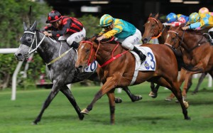 Moments In Time (outside) scores under Zac Purton at the Valley last season. Photos: Kenneth Chan