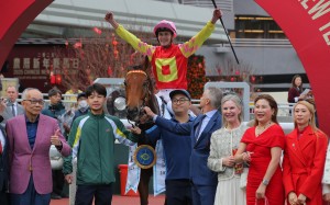Jockey Luke Ferraris celebrates his Classic Mile win on My Wish with connections. Photos: Kenneth Chan