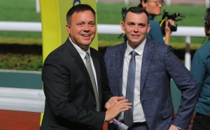 Caspar Fownes enjoys his treble with son Ronan. Photo: Kenneth Chan