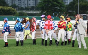 Jockeys mill around during delays to the start of race 10 at Sha Tin on Sunday. Photos: Kenneth Chan