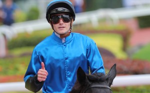Luke Ferraris gives a thumbs up after winning aboard Dazzling Fit. Photo: Kenneth Chan