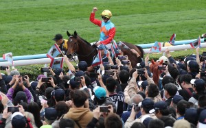 Jockey Zac Purton celebrates Ka Ying Rising’s Hong Kong Sprint success with fans at Sha Tin. Photos: Kenneth Chan
