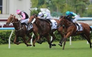 Light Years Charm (centre), ridden by Jerry Chau, wins the Lion rock Trophy at Sha Tin. Photos: Kenneth Chan