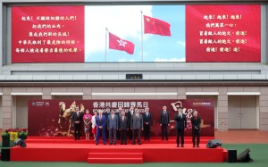 Zhang Yingxi (second from right) leads the singing of the national anthem during the opening ceremony of the Hong Kong Reunification Raceday at Sha Tin Racecourse. Photo: Kenneth Chan.