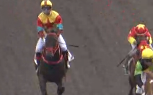 Umberto Rispoli struggles aboard Big Time Baby. Photo: HKJC