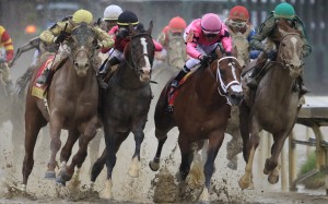Country House (yellow) and Maximum Security (pink) battle it out in the Kentucky Derby. Photo: Andy Lyons/Getty Images/AFP