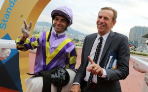 Trainer John Size celebrates his milestone with stable jockey Joao Moreira. Photos: Kenneth Chan