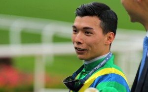 Apprentice Victor Wong returns to scale after riding a winner. Photos: Kenneth Chan