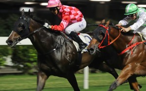 Planet Star (inside) charges home to win at Happy Valley under jockey Victor Wong. Photos: Kenneth Chan
